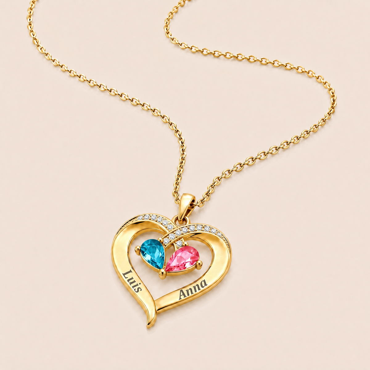Colgante de corazón en oro con dos piedras de nacimiento y dos nombres grabados